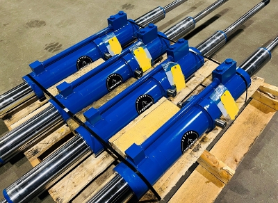 Telescopic drill feed cylinder for an OEM underground rig