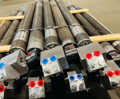 Outrigger cylinders with load holding valves